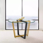 Table à manger avec plateau rond en verre et piètement en acier inoxydable brossé et fer forgé