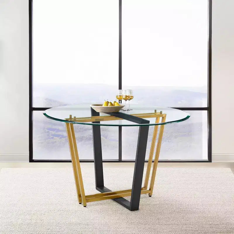Table à manger avec plateau rond en verre et piètement en acier inoxydable brossé et fer forgé