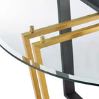 Table à manger avec plateau rond en verre et piètement en acier inoxydable brossé et fer forgé