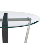 Table à manger avec plateau rond en verre et piètement en acier inoxydable brossé et fer forgé