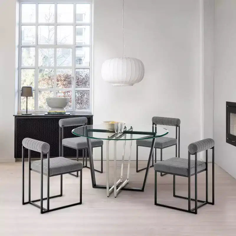 Table à manger avec plateau rond en verre et piètement en acier inoxydable brossé et fer forgé